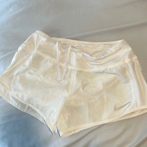 NIKE white athletic shorts.